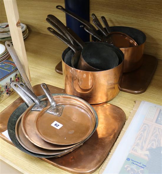 Five various copper pans various lids and a frying pan and two trays